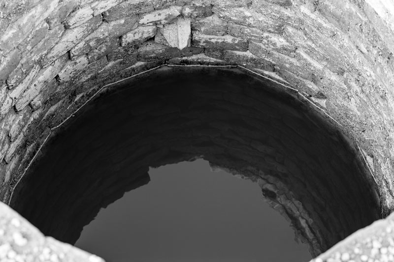 A fully recharged 'kuin' (shallow well) during monsoon season - village Binjharwali, Bikaner district, Rajasthan